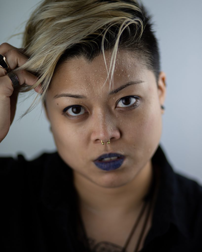 Portrait of girl wearing blue lipstick