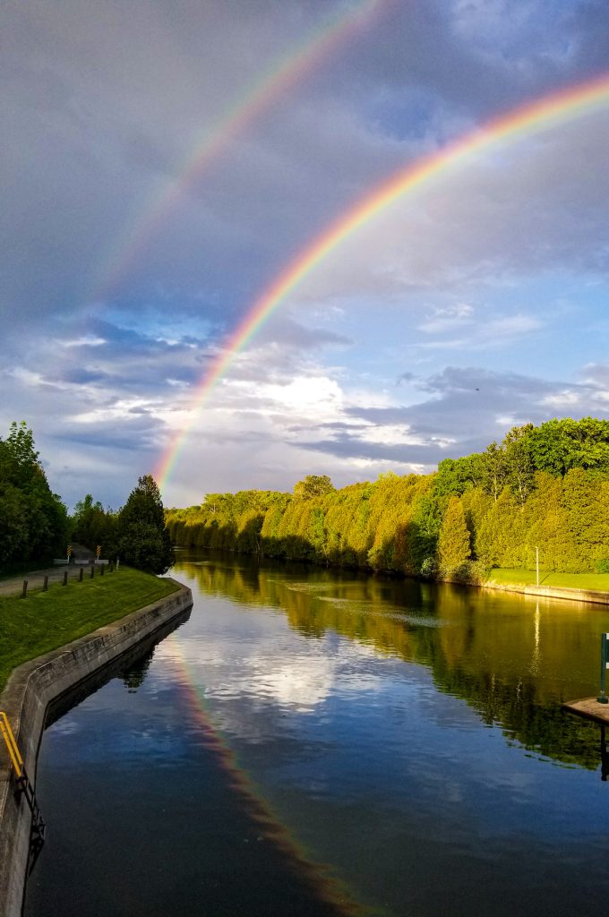 double rainbow over water